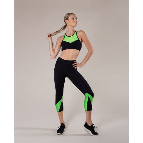 Model wearing Energetiks Bailey 7/8 Legging Shattered Glass Fluro Lime front view
